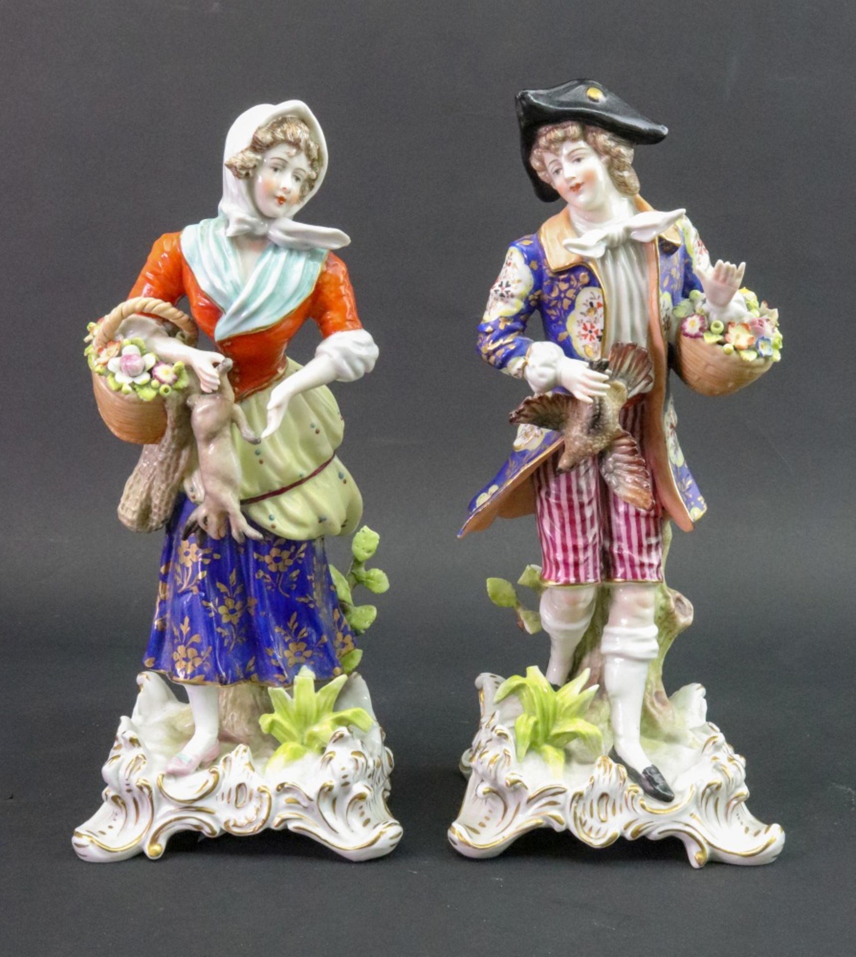 A pair of continental porcelain figures, one modelled as a young man in a floral coat,