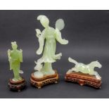 Three Chinese green hardstone figures, 20th century,