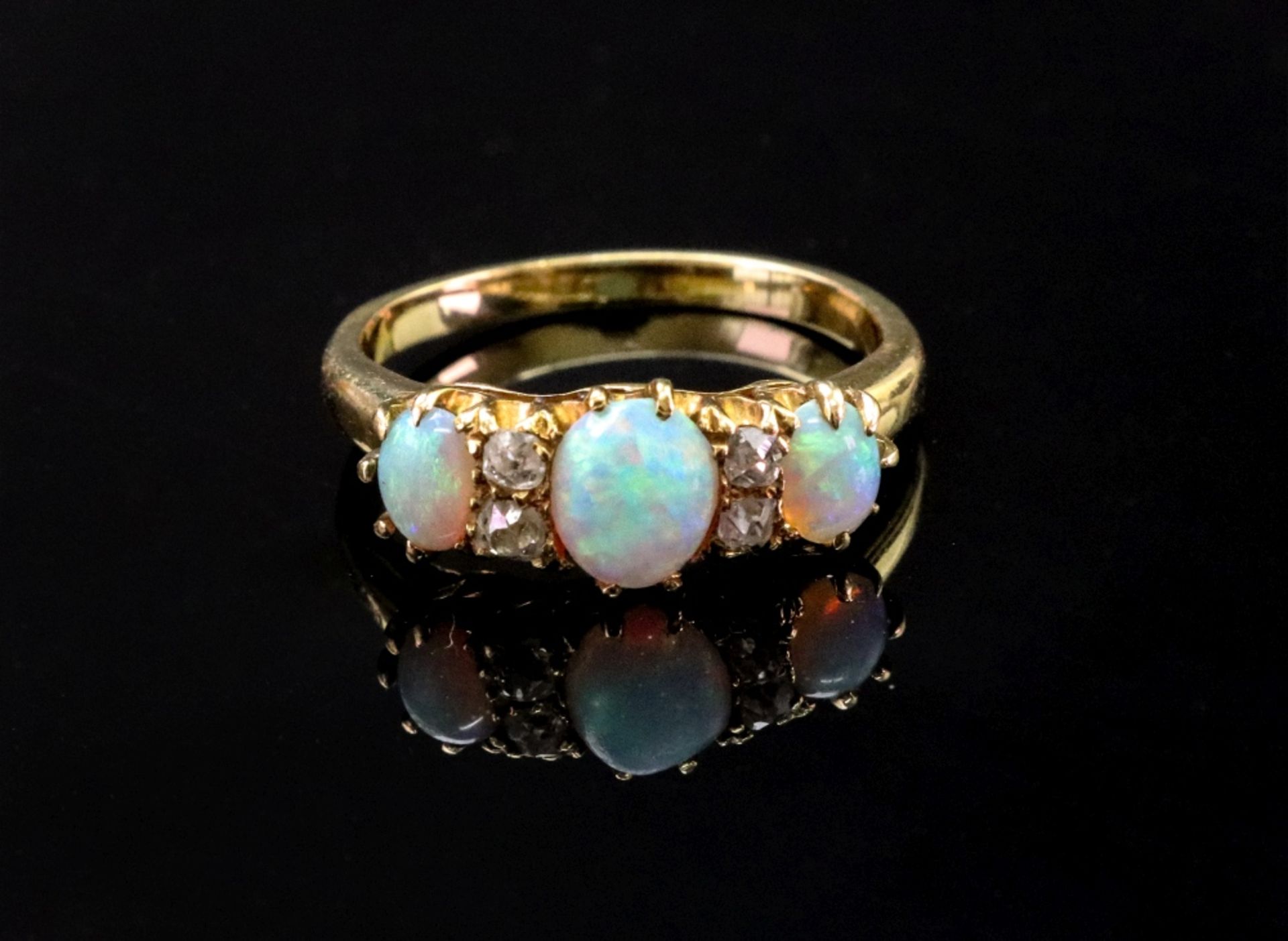 A gold, opal and diamond set ring,