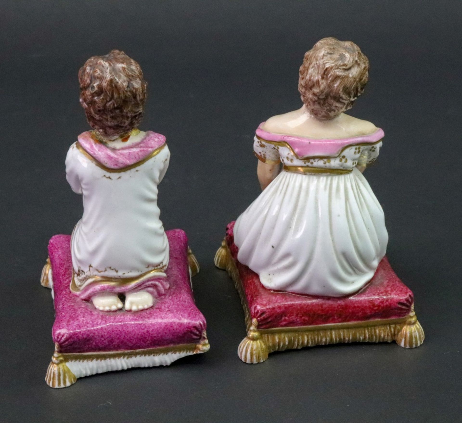 A Bloor Derby figure of a young girl, circa 1830, modelled kneeling to tie up her shoelaces, - Image 2 of 4