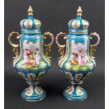 A pair of Austrian two handled baluster vases and covers,