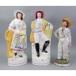 A pair of Victorian Staffordshire pottery figures of fish vendors, 35.