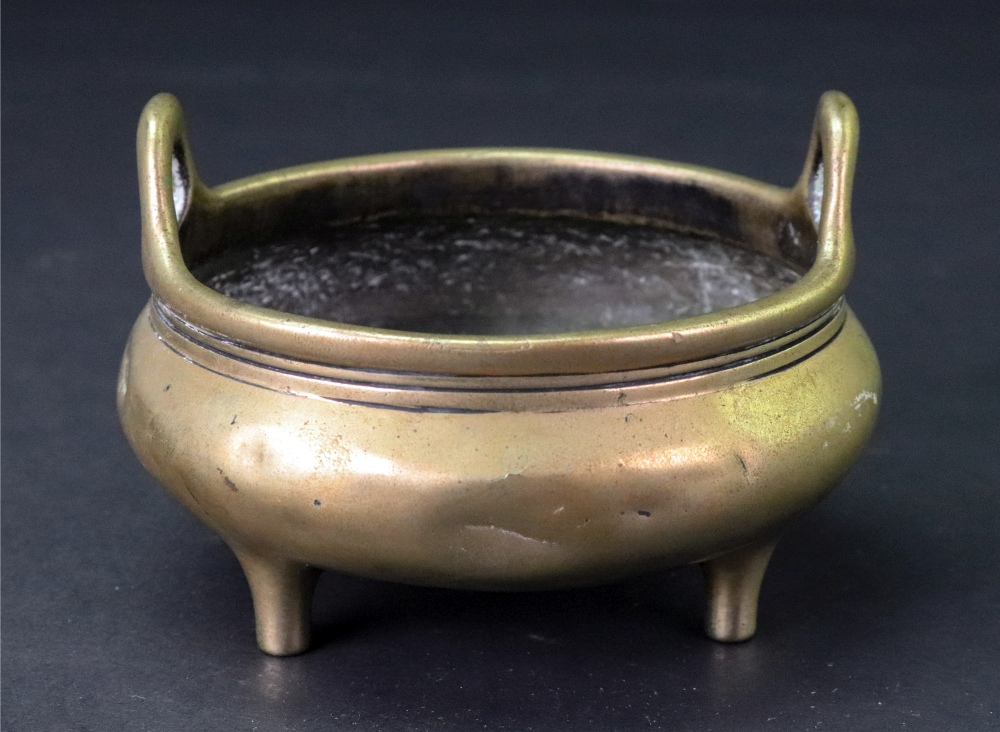 A Small Chinese bronze two handled tripod censer, six character Xuande mark but later,