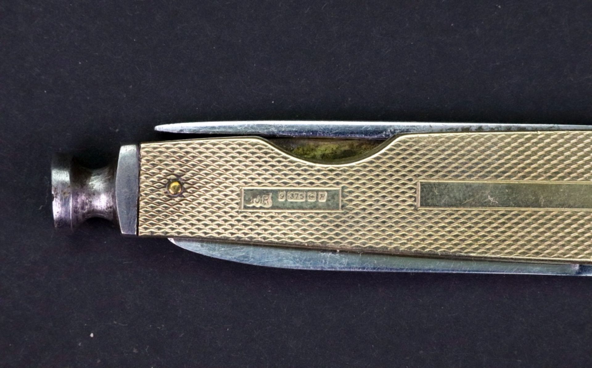 A 9ct gold mounted steel penknife, Birmingham 1964, engine turned with vacant cartouche, 7cm long. - Image 4 of 4