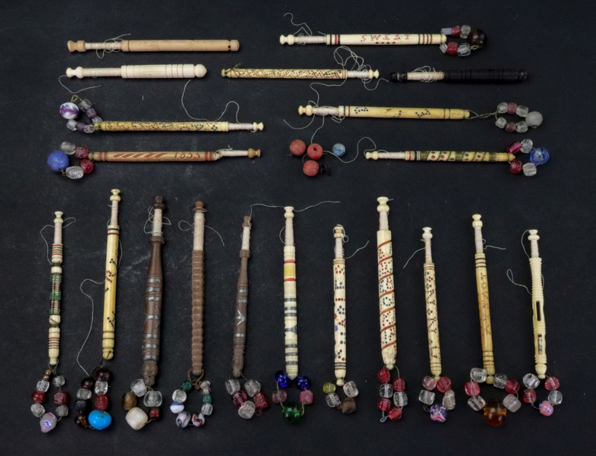 A collection of thirteen bone lace bobbins, mostly Victorian,