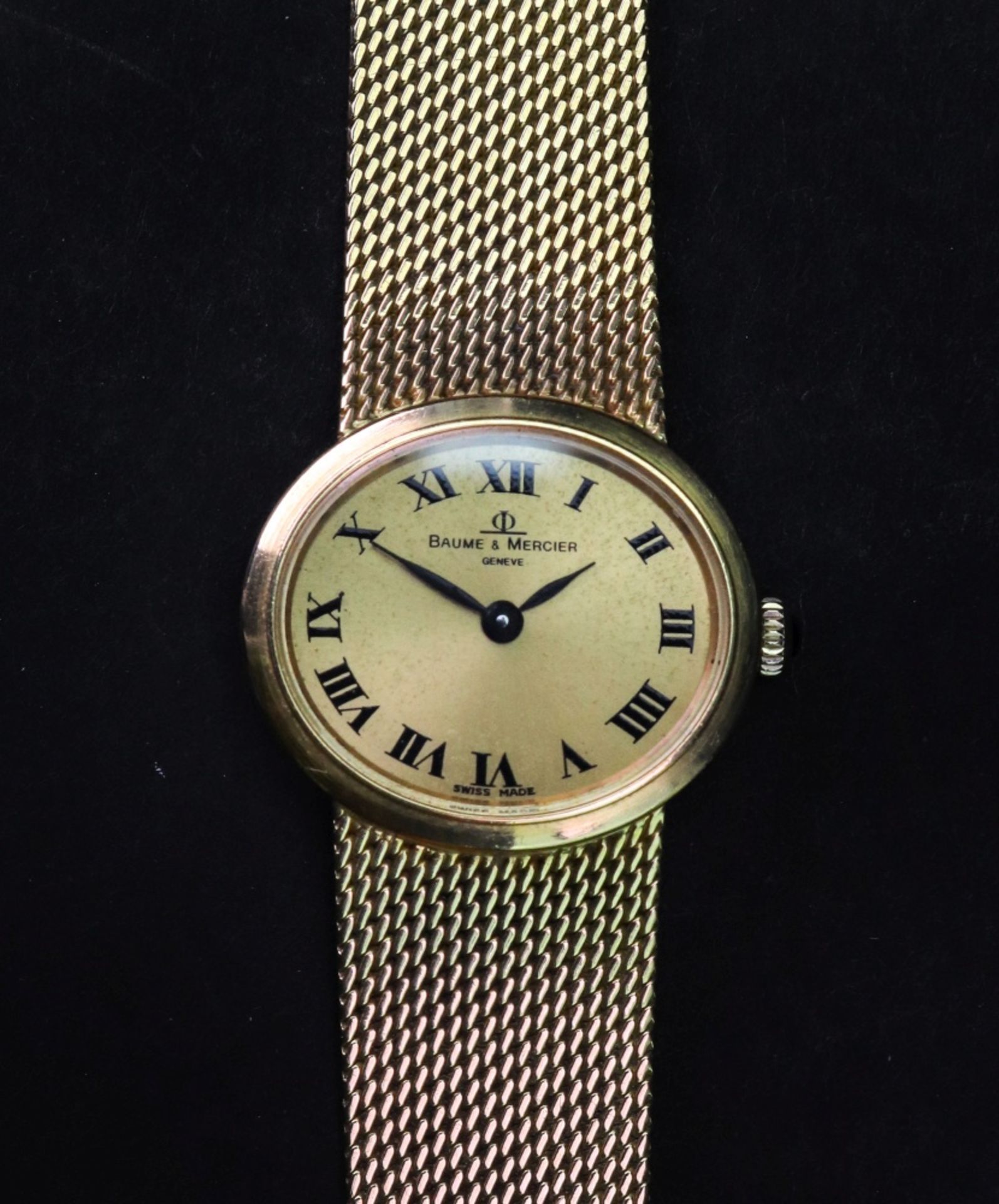 Baume & Mercier; a lady's 18ct gold bracelet watch, the oval dial with Roman numerals,