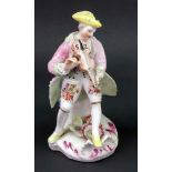 A Derby figure of a musician, circa 1758-60, modelled as a young man seated playing the violin,