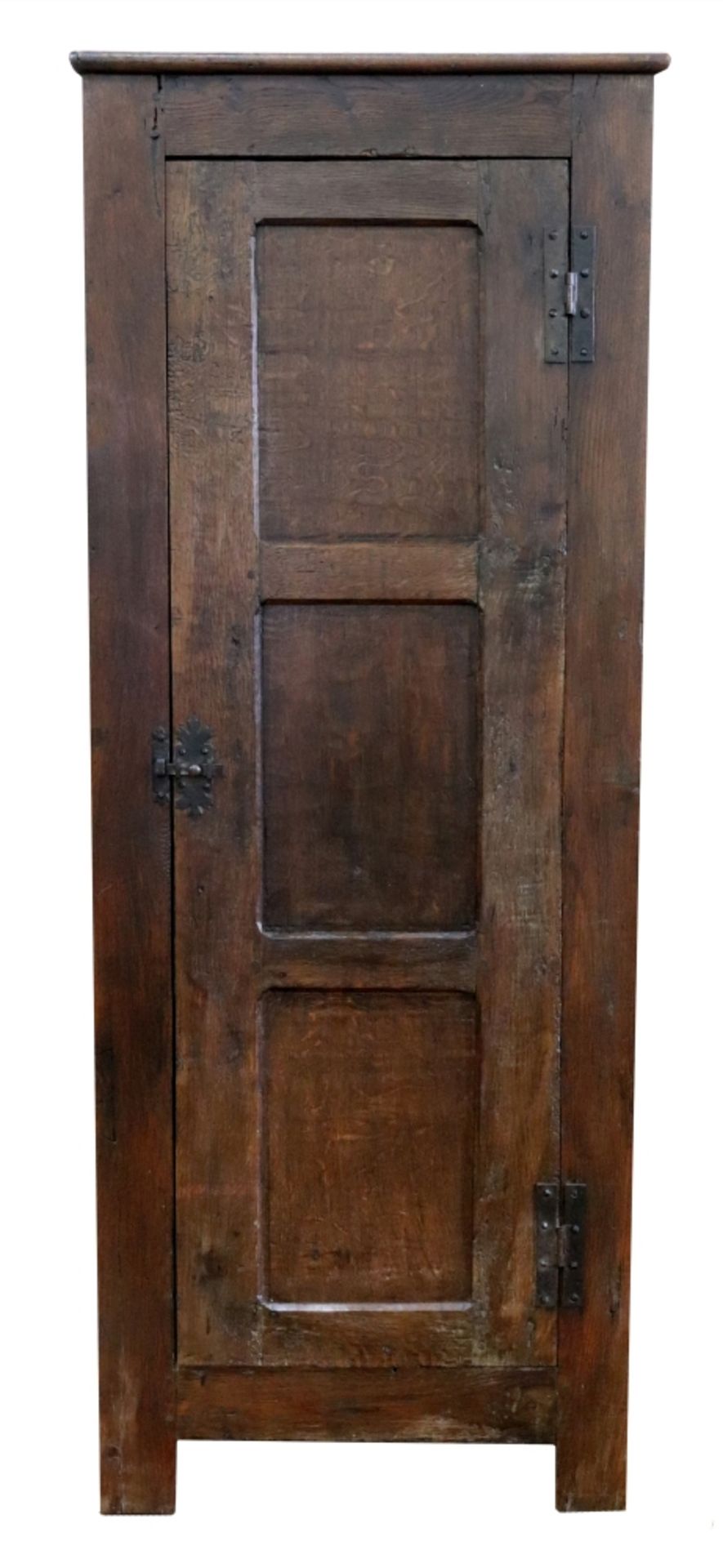 A 17th century style oak vestments cupboard, of panelled construction,