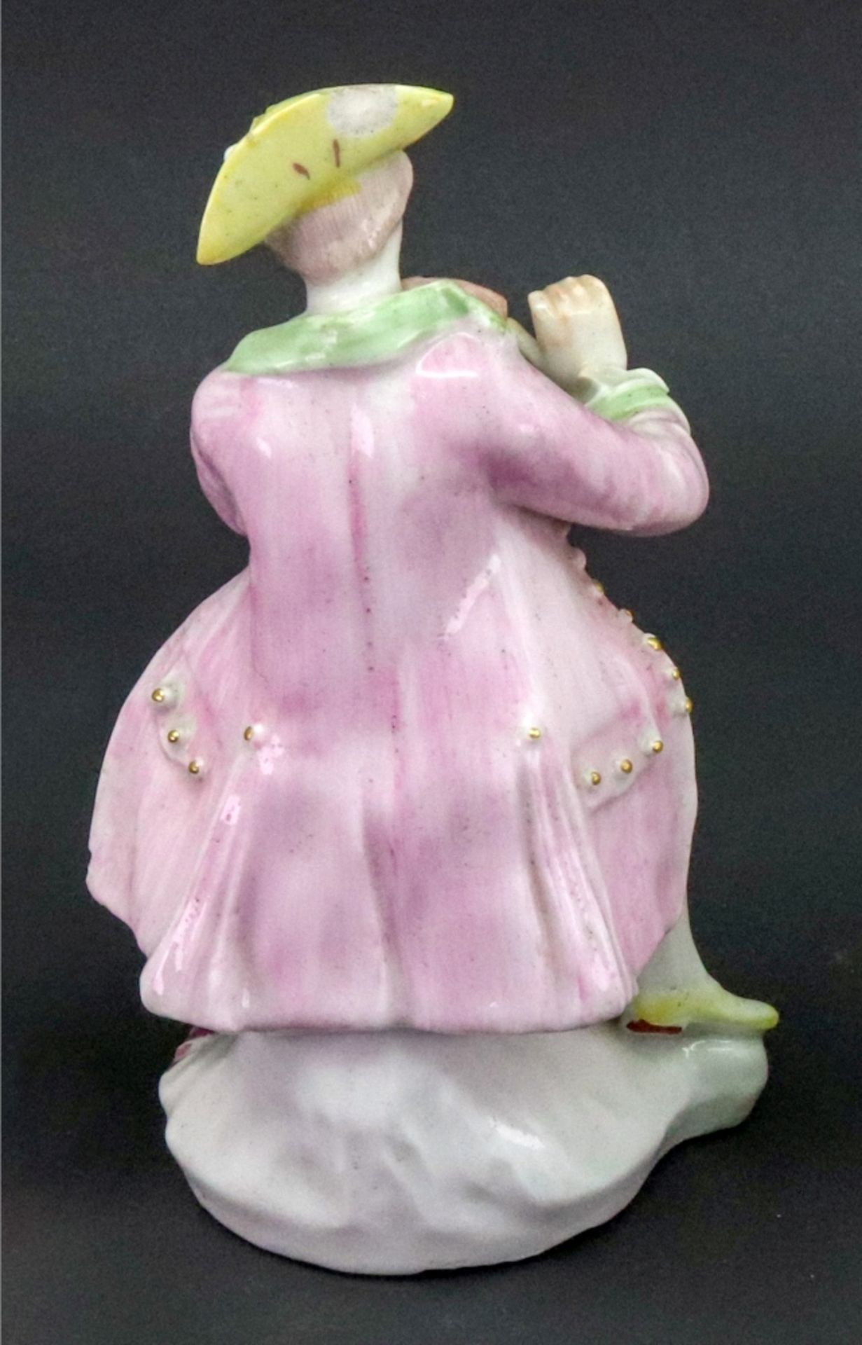 A Derby figure of a musician, circa 1758-60, modelled as a young man seated playing the violin, - Image 2 of 3