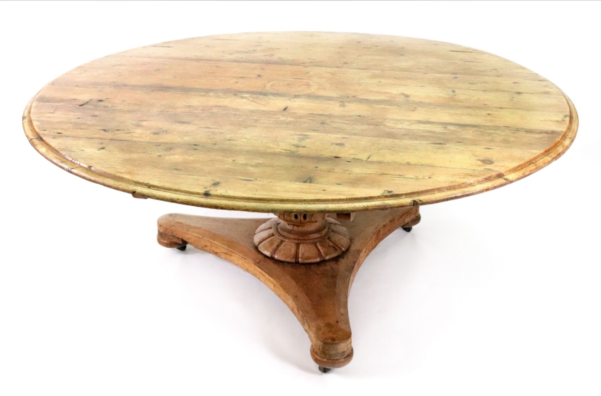 A William IV waxed pine circular dining table,