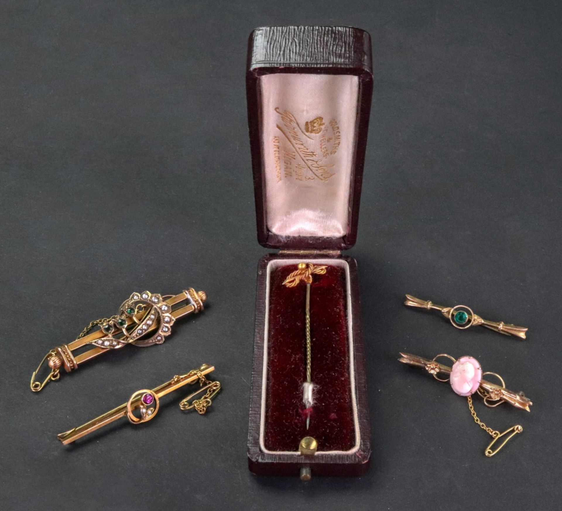 Four bar brooches, comprising; two seed pearl and gemset brooches, stamped 9ct,