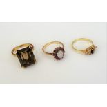 A 9ct ring, claw set with a cut cornered rectangular step cut citrine, a gold,