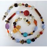 A varicoloured faceted and polished hardstone and coral bead necklace, designed by Elena Vosti,