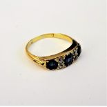 A gold, sapphire and diamond set ring,