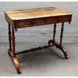 A 19th century rosewood rectangular two drawer writing table, on turned supports,