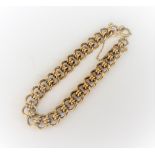 A 9ct gold bracelet, in an interlooped link design on a boltring clasp with a safety chain, 28.1gms.
