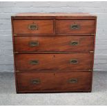 A campaign style brass bound mahogany chest of two short and three long graduated drawers,