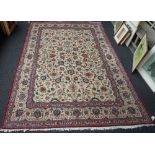 A Kashan carpet, Persian, the ivory field with an all over floral vine design,