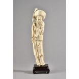 A Chinese ivory figure of an elderly man, late 19th/early 20th century,