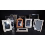 A quantity of modern strut back photographic frames, including a Linley leather bound frame, (23.