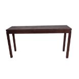 A 20th century hardwood rectangular side table on square supports,