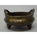 A small Chinese bronze two-handled censer, six character Xuande mark but later,
