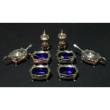 Mappin & Webb; a silver eight place cruet set, Birmingham 1915, cased, comprising four salts,