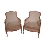 A pair of Louis XV style stained beech bergere chairs, on cabriole supports.
