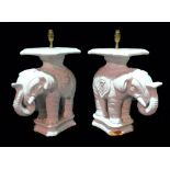 A pair of modern white crackle glaze ceramic table lamps formed as Chinese elephant garden seats,