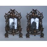 A pair of copper gilt cast iron photograph frames,