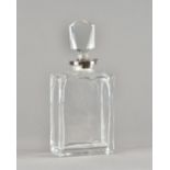 An Edward VII silver mounted cut glass lockable decanter, (lacking key),