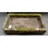 A rectangular carved stone sink, 99cm wide x 17cm high.