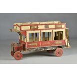 A scale model 'London bus', mid-20th century, polychrome painted wood, (a.f.), 93cm wide.