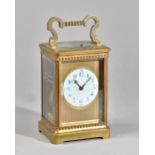 A FRENCH BRASS PETITE SONNERIE CARRIAGE CLOCK Circa 1900 In a stylised Corniche case with shaped