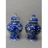A pair of Chinese blue and white baluster vases and covers, circa 1900,