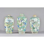 Three Chinese famille-verte ovoid vases and a cover, probably Kangxi,
