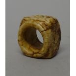 A Chinese cream and brown jade cong, probably 4th century B.