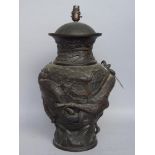 A Japanese mixed metal vase, relief cast with dragon chasing a flaming pearl,