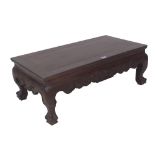 An early 20th century Chinese hardwood low table on claw feet, 76cm wide x 41cm deep x 28cm high.