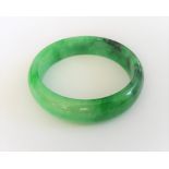 A jadeite jade bangle, the exterior domed, the interior flat, size 7.03 mm deep x 15.