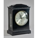 A REGENCY EBONISED BRACKET CLOCK By Cumming,