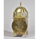 A BRASS QUARTER-STRIKING LANTERN CLOCK Circa 1910 The case of typical form,