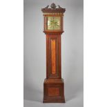 A WALNUT AND OAK LONGCASE CLOCK The associated movement by Thomas William Lutwych,