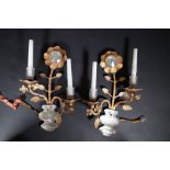 A pair of Maison Bagues style gilt metal and crystal two branch wall lights,