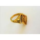 An 18ct gold, citrine and diamond ring,