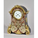 A NAPOLEON III ORMOLU-MOUNTED BOULLE MANTEL CLOCK Circa 1860 The arched case with gadrooned edge