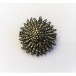 A silver and marcasite set brooch watch, designed as a single flowerhead,