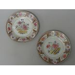 A pair of Chinese famille-rose plates, Qianlong, each painted with a central vase of flowers,
