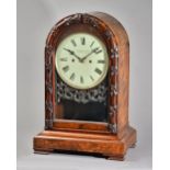 A VICTORIAN WALNUT QUARTER-STRIKING LIBRARY CLOCK Signed William & Thomas Owen, Oswestry,