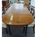 A Regency mahogany extending dining table with pair of 'D' end sections and central drop flap all